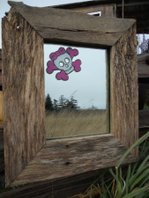 http://www.etsy.com/shop/dkStuff17

Was an old piece of mirror, some old glass and a discarded pallet....