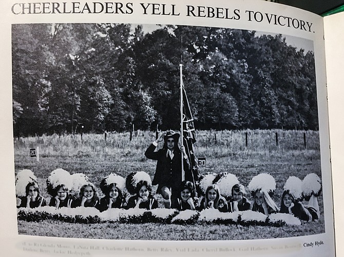 U.S. Sen. Cindy Hyde-Smith appears third from the right in a 1975 yearbook photo of cheerleaders at Lawrence County Academy. The mascot appears in the middle dressed as a Confederate colonel holding a rebel flag.