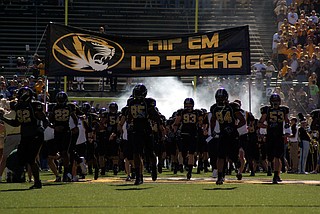 Some black football players at the University of Missouri are joining protests over racist incidents on the Columbia campus.