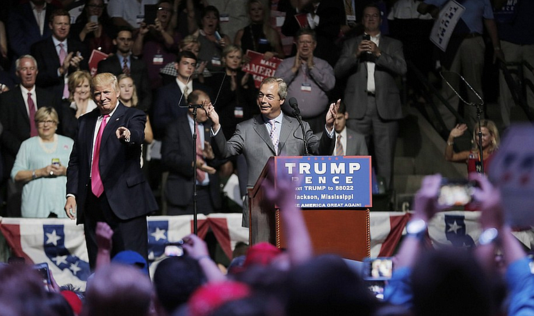 Nigel Farage of British Brexit fame spoke at the Mississippi Coliseum on Aug. 25, 2016, during a rally Donald Trump (left) held in Jackson. Gov. Phil Bryant apparently introduced Trump and Farage before the rally, and has now invited his Brexit friend to attend Trump's inauguration.