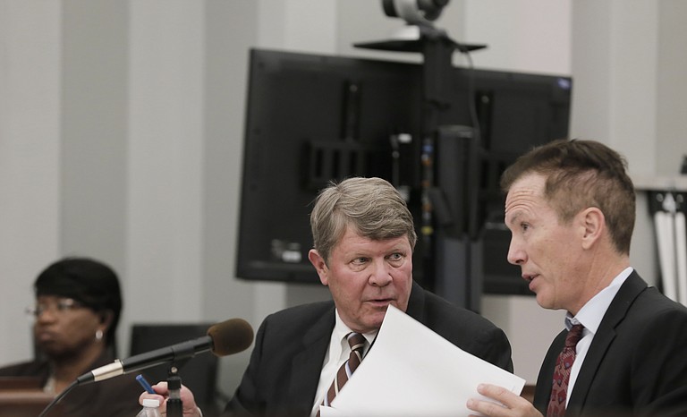 The jury is deliberating whether Downtown Jackson Partners President Ben Allen (left) is guilty or innocent of embezzling public funds. He is seen here talking with one of his attorneys, Merrida Coxwell (right).  