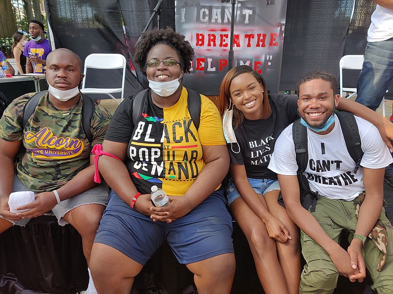 Four of the Jackson Black Lives Matter protest's primary organizers—from left: Calvert White, Taylor Turnage, Maisie Brown and Timothy Young—speaking to media after the event's end on June 6, 2020. Photo by Nick Judin
