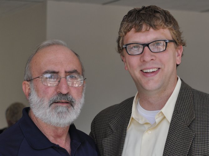 Hank Holmes, left, director of the Mississippi Department of Archives & History, with Robert Luckett, right, the director of the Margaret Walker Center, after his Jackson 2000 presentation on July 11, 2012.