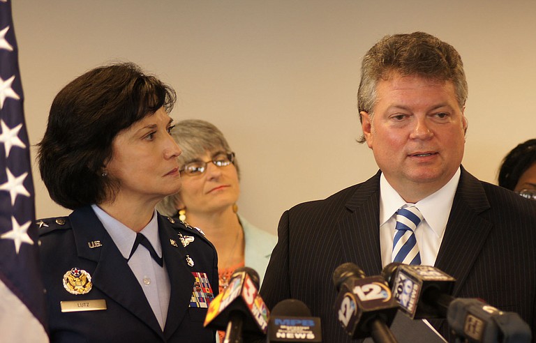 Mississippi Air Guard commander Major General Catherine S. Lutz and, left, and Mississippi Center for Justice advocacy director Beth Orlansky, center, say a new state program will benefit people hurt in the foreclosure crisis.