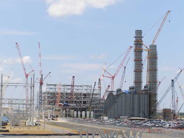 Opponents of Mississippi Power's 582-megawatt generating station in Kemper County question if the company's financial setbacks have resulted in a work slowdown at the plant, under construction since 2010.