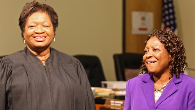 Hinds County Chancery Judge Patricia Wise (left) swore in Beneta Burt (right) to the JPS school board Wednesday.