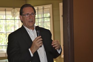 Dozens of citizens grilled David Kelly at Koinonia Coffee House's Friday Forum, sending the Chartre Consulting representative to the exit soon after his parting words.