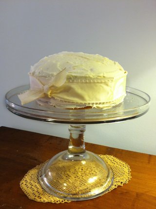 Pretty ribbon and a glass pedestal dress up a favorite cake—or any dessert—for a party.