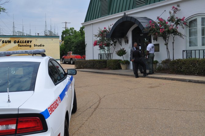 JPD officers stand outside the BankcorpSouth building on N. State Street.