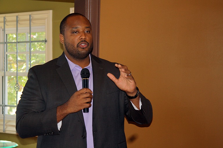 Corey Wiggins, project manager for MHAP, talked to citizens at Koinonia Coffee House Friday about the aspects of the Affordable Care Act that will soon take effect.
