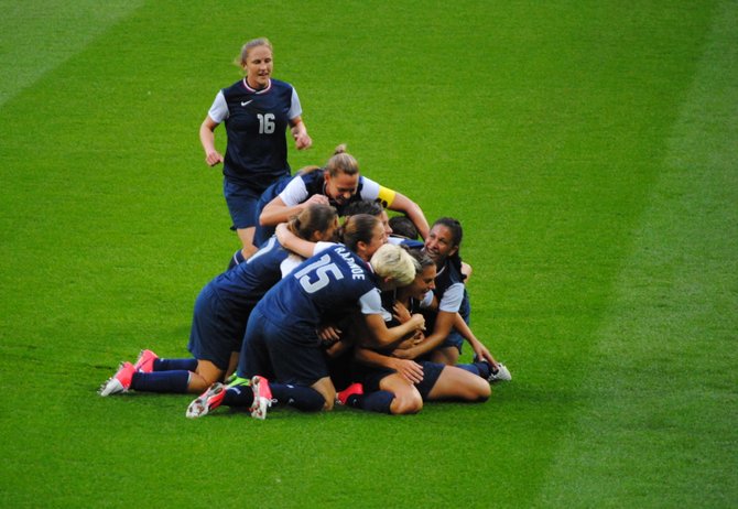The U.S. Women's soccer team celebrates after defeating Japan 2-1 for the gold.
