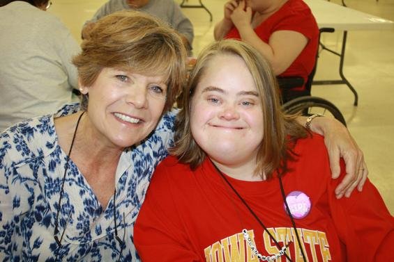 A charity baseball game Aug. 23 benefits the Mustard Seed "Seedsters" like Logan, right, shown with her mother Cindy Chew.
