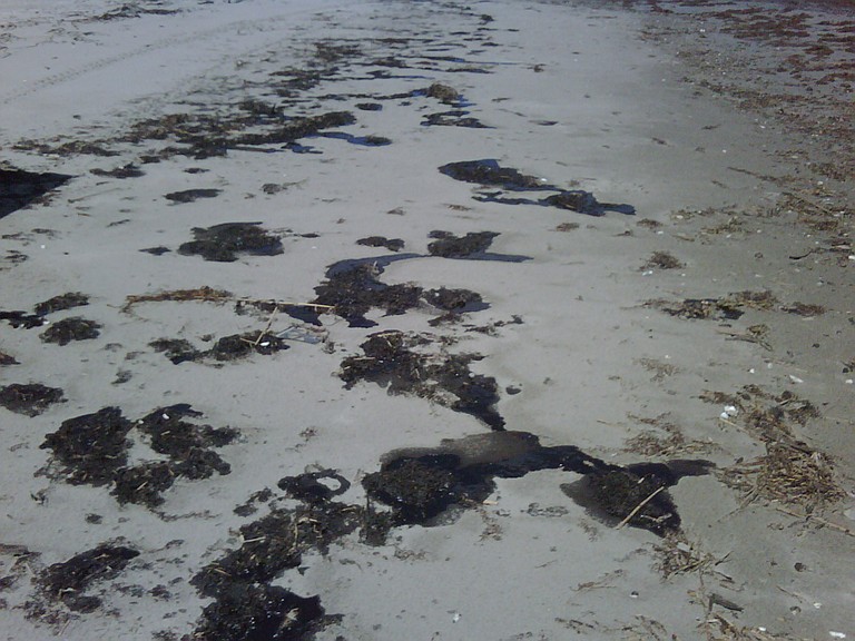 Hurricane Isaac disturbed oil from the 2010 BP disaster, washed up on Gulf beaches.