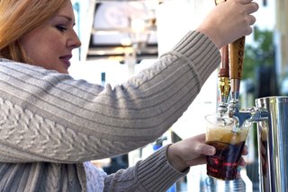 Katie Parkman pours a craft beer at last year's Jacktoberfest.
