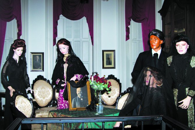 Antique dolls stand vigil in Merrehope Mansion in Meridian.
