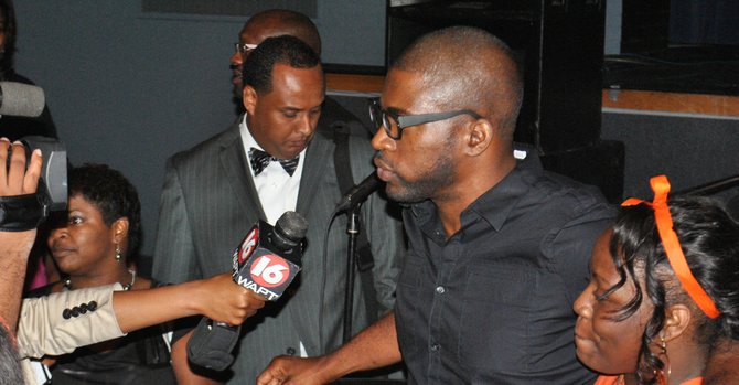 David Banner stands with a student of Jackson State University at the "Words I Never Said: Moving a Hip Hop agenda in 2012" event.