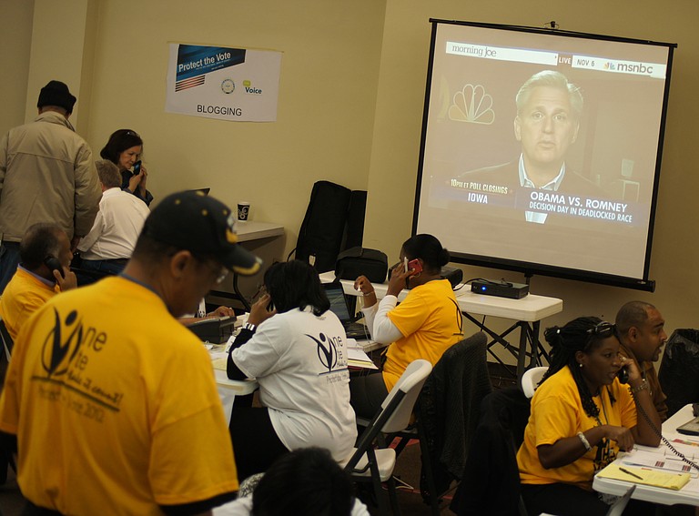 Dozens of gold-shirted volunteers at the NAACP's Protect the Vote headquarters are busily fielding a steady stream of calls from across the state to the organization's voter helpline.