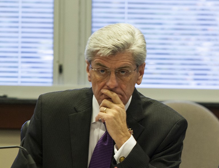 Gov. Phil Bryant got news from state economist Darrin Webb Monday that the state's economy is growing, slowly, but it isn't translating into job growth.