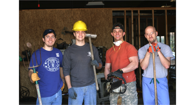 Jackson Free Clinic volunteers began a recent expansion with a demolition party. Pictured from left: Brad Deere, Stephen Sills, Bobby Tullos and Jeb Clark.