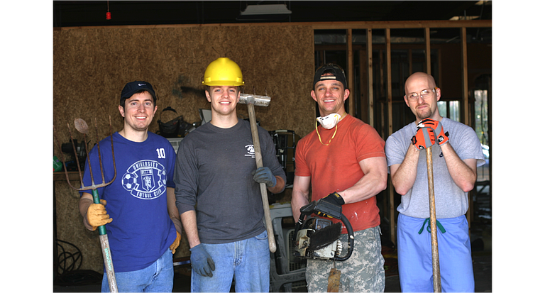 Jackson Free Clinic volunteers began a recent expansion with a demolition party. Pictured from left: Brad Deere, Stephen Sills, Bobby Tullos and Jeb Clark.