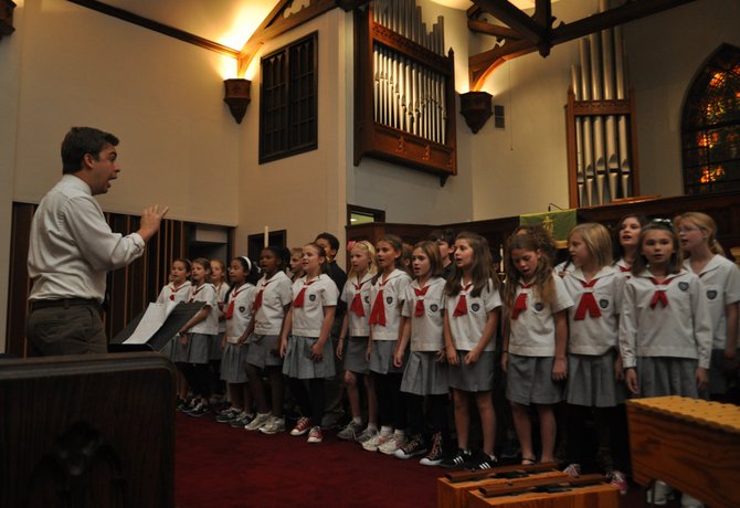 Scott Sexton conducts kids from St. Andrew’s in a performance at Fondren Unwrapped.