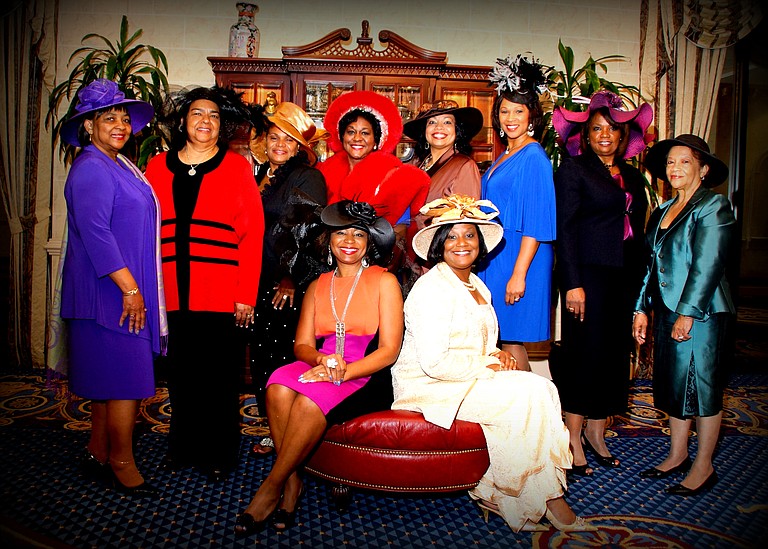 The women of the Top Hat Brunch show off their headwear. Back row, left to right: Terryce Walker, Gloria Johnson, Sonia Carter, Rita Wray, Lenora Lewis, Katrina Myricks, Wauline Carter and Ethel Gibson; seated: Sharolyn Smith, 2012 Holiday Top Hat chairwoman, and Belinda Arnold Fields, President of the National Coalition of 100 Black Women, central Mississippi chapter.
