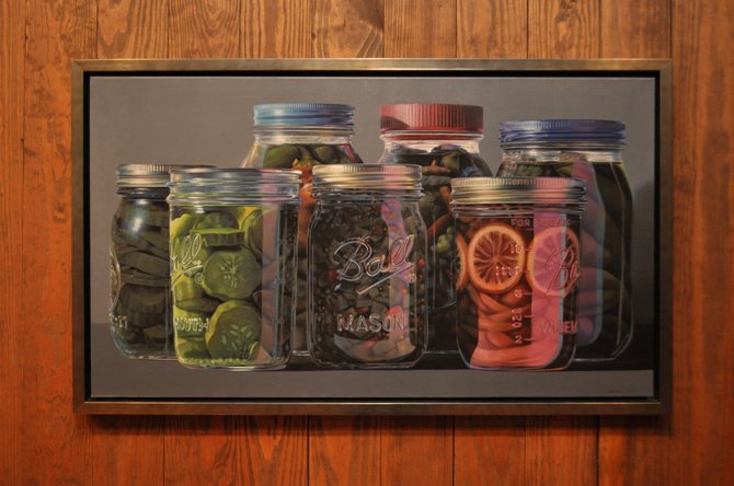 One of Tutor’s most popular paintings of mason jars also hangs in the Mississippi Museum of Art. 