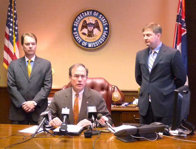 Opponents say that Secretary of State Delbert Hosemann's voter exit poll is the wrong way to determine numbers of potentially disenfranchised voters. Hosemann is seated in the photo, above.