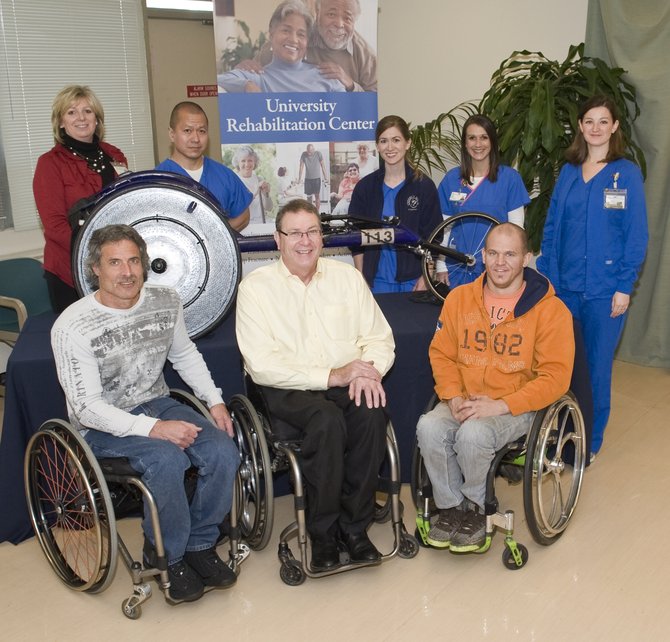 Front from left: Grant Berthiaume of Arizona, Paul Erway of Kentucky and Aaron Roux of Arizona. Standing from left: Shelly Poole, administrator of rehabilitation services at UMMC;  Boon Ong, University Rehabilitation Center physical therapist; Amy Fountain, URC physical therapist; Holly Burney, URC occupational therapist; and Meredith Duncan, URC occupational therapist.