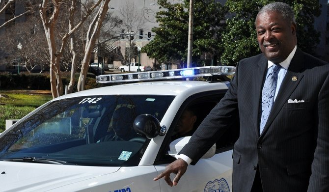 Mayor Harvey Johnson Jr. unveiled six police cars painted with Crime Stoppers logos and numbers Wednesday.
