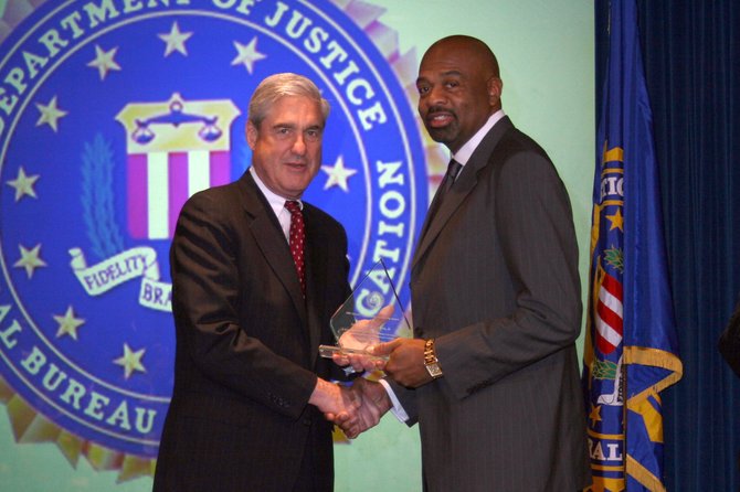 FBI Director Robert S. Mueller III (left) and and James E. Graves Jr. (right)