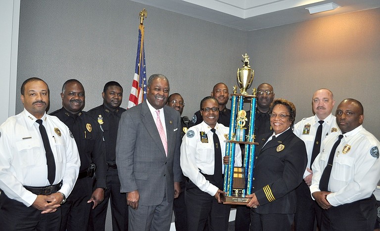 Mayor Harvey Johnson Jr. (fourth from left) and JPD Chief Rebecca Coleman (third from right) recently recognized the efforts of Precinct 1 cops to reduce crime in the first quarter of 2013.