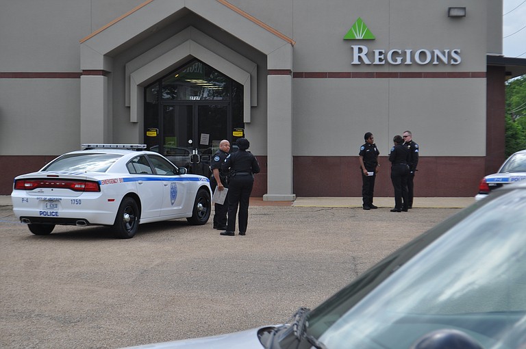 Police officers at the Regions Bank in Fondren --- North State Street.