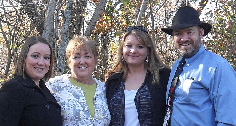 Robin Burton (shown with daughter Lindsay on the far left, son Tommy on the far right, and Tommy’s fiancee Michelle Beard to his left) mothered kids across Jackson in addition to her own.