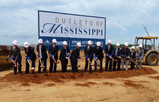 Lawmakers, developers and investors ceremoniously break ground on Pearl’s Outlets of Mississippi.