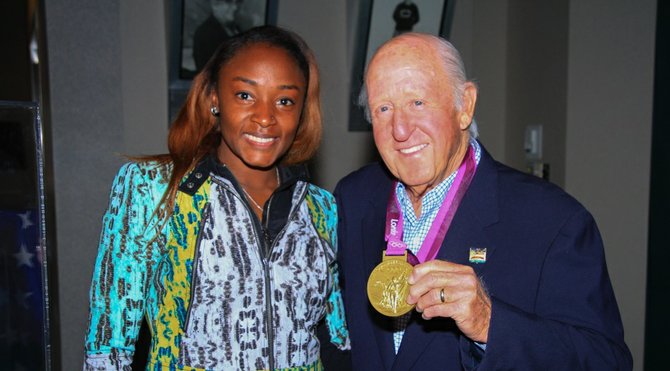 Longtime sports supporter Ben Puckett, seen here with Olympian Bianca Knight, will be remembered for his kindness and optimism.