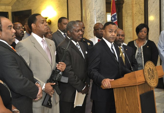 Hinds County District Attorney Robert Smith spoke out at the Mississippi Capitol today against an open carry law going into effect July 1. Legislative Black Caucus Chairman Sen. Kenneth Wayne Jones, D-Canton, displayed a semi-automatic weapon at the June 27 press conference.