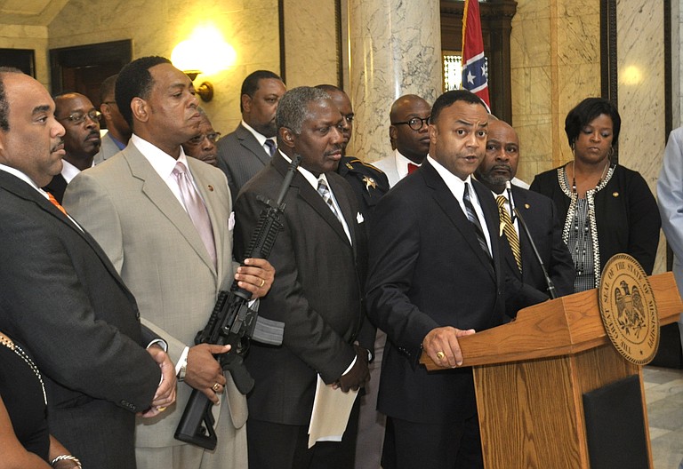 Hinds County District Attorney Robert Smith spoke out at the Mississippi Capitol today against an open carry law going into effect July 1. Legislative Black Caucus Chairman Sen. Kenneth Wayne Jones, D-Canton, displayed a semi-automatic weapon at the June 27 press conference.