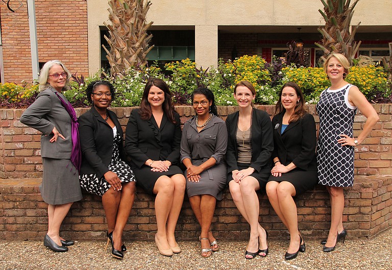 The 2013 Heroes of the Year are the members of the Women’s Initiative at Baker Donelson, including (from left) Sheryl Bey, Marlena Pickering, Ashley Tullos, Kenya Rachal, Alicia Hall, Anna Powers and Amy Champagne.