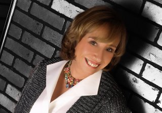 Liz Stauffer signs her latest murder mystery at Lemuria Saturday.