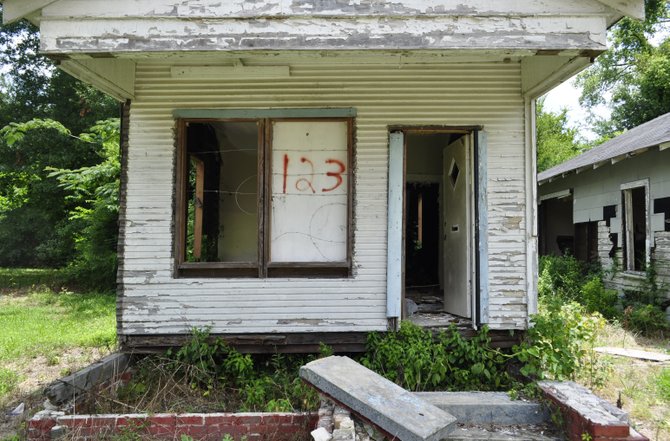 Abandoned and dilapidated houses, such as this one on Farish Street, are common in parts of Jackson and neighbors are fed up.