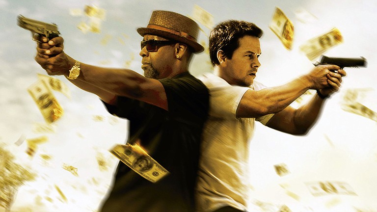 Denzel Washington and Mark Wahlberg star in “2 Guns.