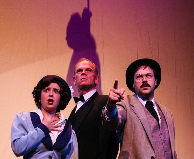 Beth Kander, Ray McFarland and John Howell star in “Sherlock Holmes and the Adventure of the Suicide Club” at New Stage Theatre.