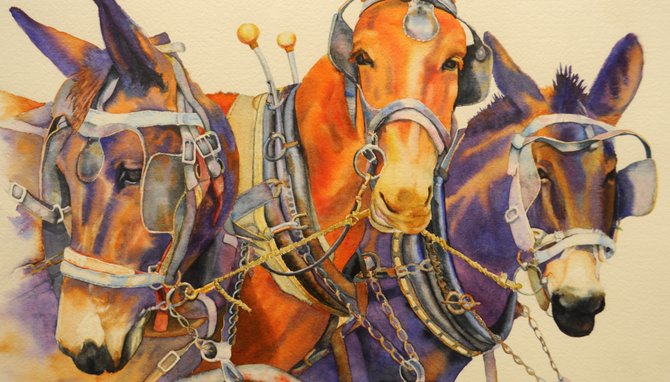 Sue Wellington’s “Just Hitched” is one of many multicolored watercolors on display at Hinds Community College now.