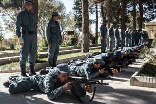 Afghan National Police cadets steady rifles as they learn to assemble and de-assemble them at the Kabul Police Academy on Nov. 14, 2012, in Kabul, Afghanistan.