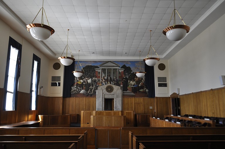The courtroom on the fourth floor features the controversial 1938 mural on one of its walls that is one part of the James O. Eastland Federal Building that must be preserved, as mandated by the Mississippi Department of Archives and History.
