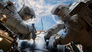 Sandra Bullock and George Clooney shine in the outer-space thrill ride “Gravity.”