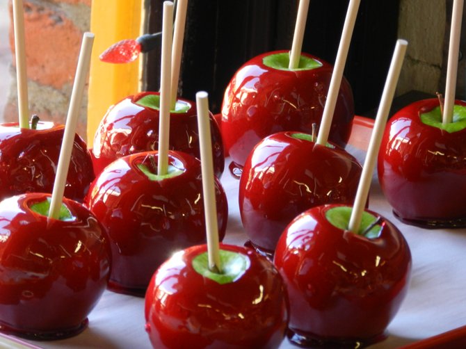 A make-your-own candy apple bar is a decadent and fun way to bring fall flavors to your wedding reception.