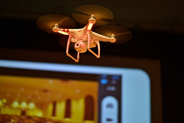 Phantom, a drone designed to take photographs from the air, is demonstrated at the Drones and Aerial Robotics Conference, held at New York University, on Oct. 12, 2013.