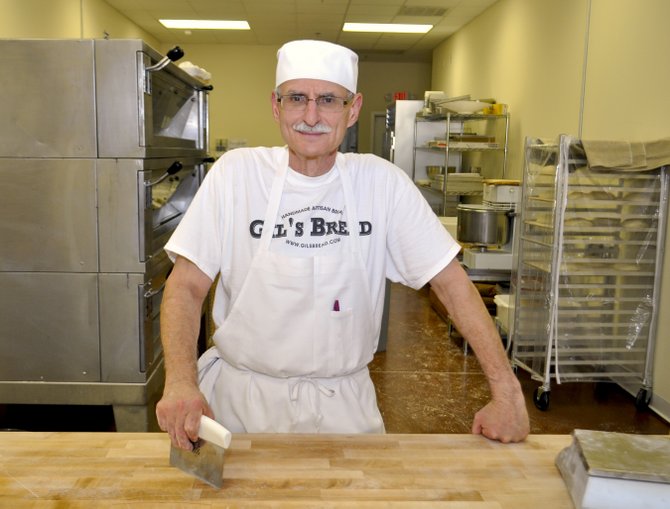 A former investment banker, Gil Turchin now spends his days baking bread in his shop.